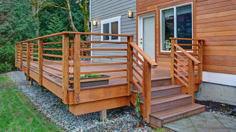 Wooden steps leading up to a deck