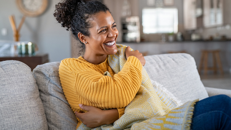 Woman sitting with blanket