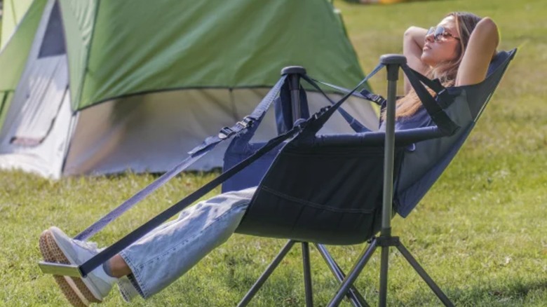 Woman sitting in hammock chair