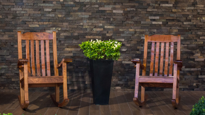 Tall planter flanked by chairs