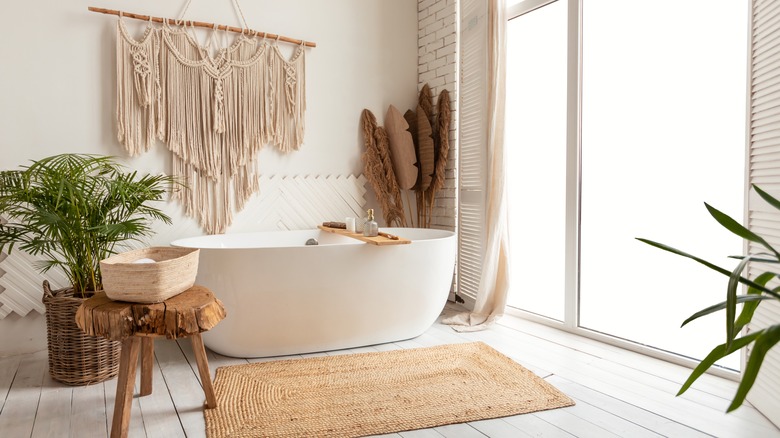 free-standing bathtub in tropicalcore bathroom