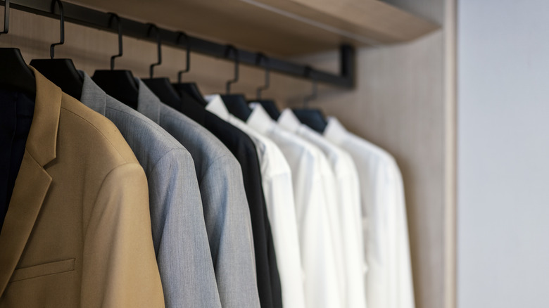 Shirts on matching hangers in a closet