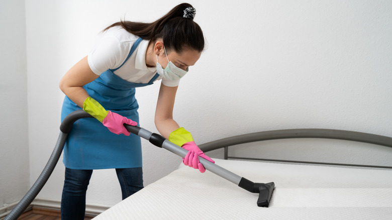 woman cleaning a mattress