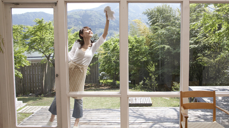 Woman cleaning windows 