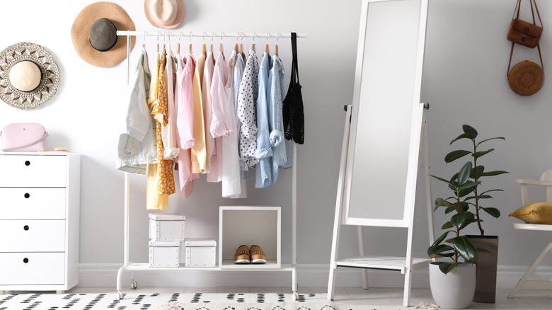 white rack with colorful clothes