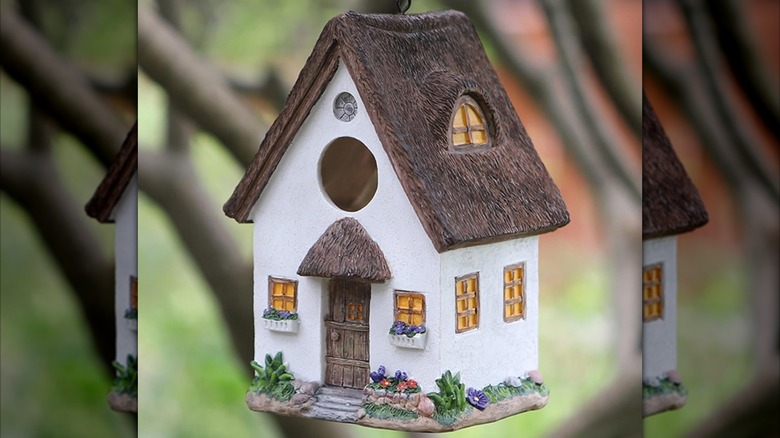 white cottage-style birdhouse
