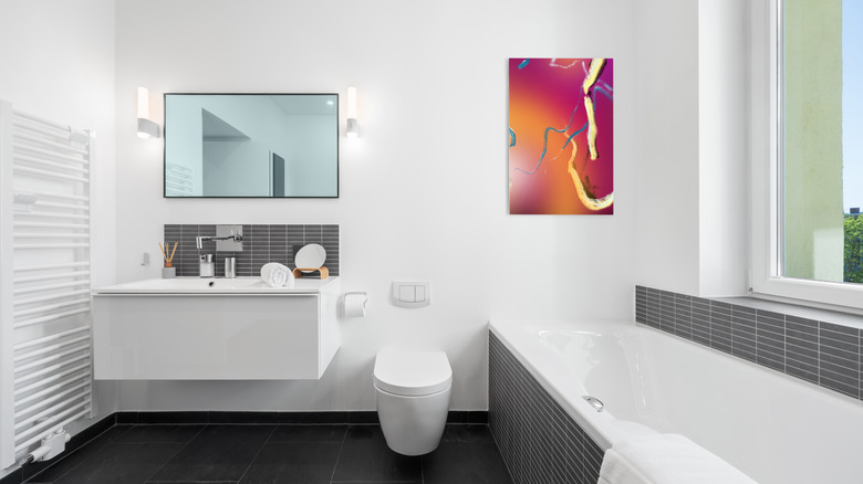 Sleek bathroom with colorful artwork