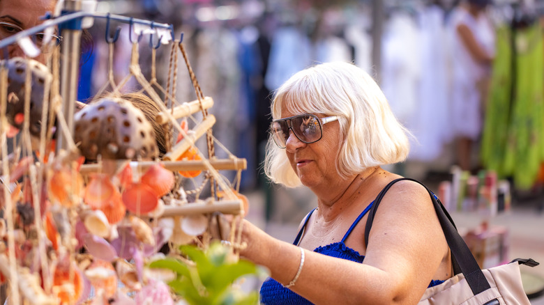 happy woman in garden store