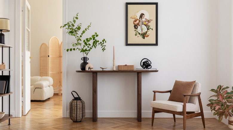 Table and chair in a white-painted room