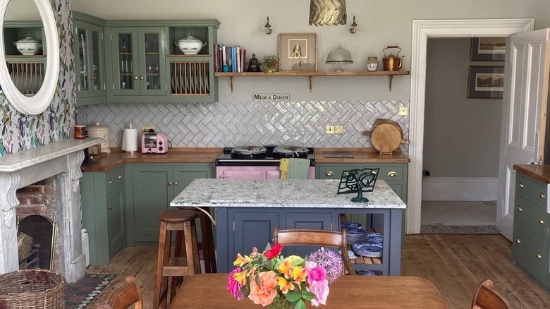 Kitchen with olive green upper cabinets and navy blue lower cabinets