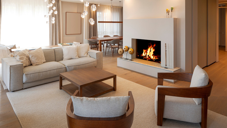 A modern living room with a wood burning fireplace