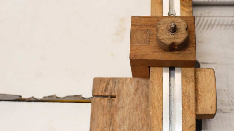 A DIY stop block in a T-track on a table saw sled