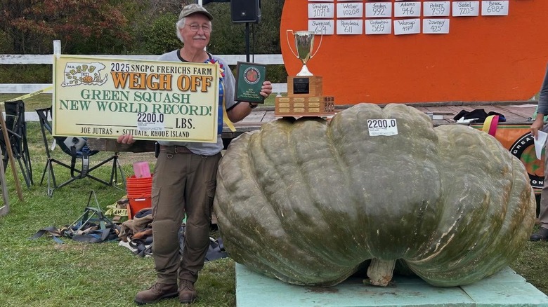 Joe Jutras poses with the world's biggest green squash.
