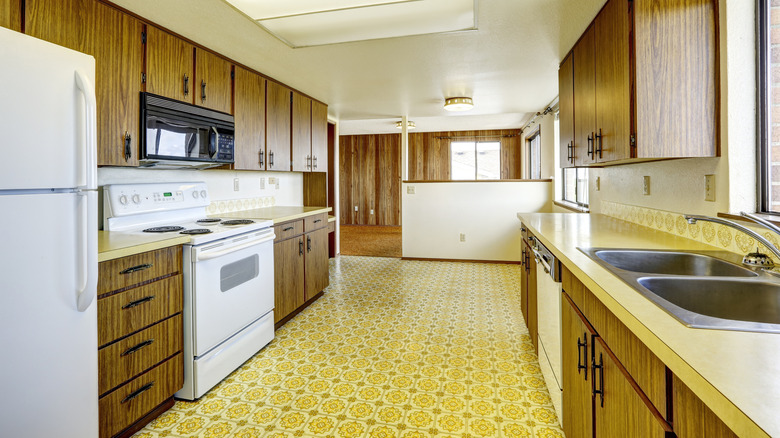 Retro kitchen with bright yellow linoleum flooring