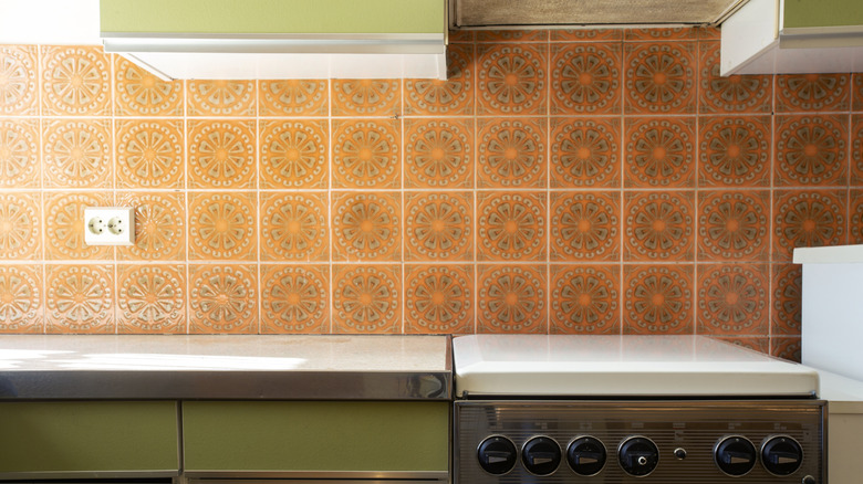 1970s kitchen with bright colored tile backsplash