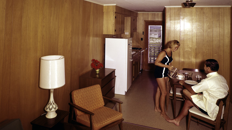 Warm wood paneling from the kitchen to the living room