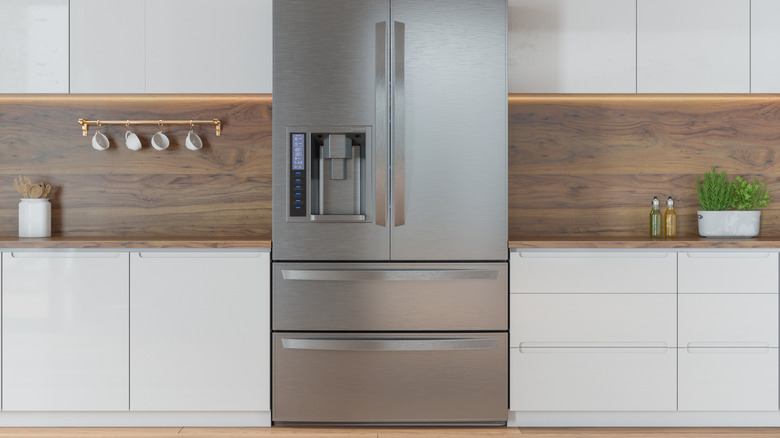 Fridge in white and wood kitchen