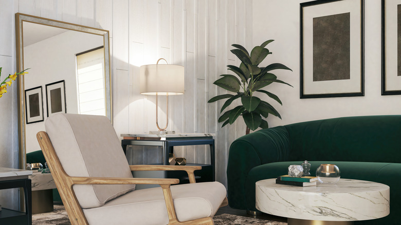 A living room with a mirror facing the sofa