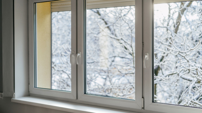 glass casement windows on winter day with snow