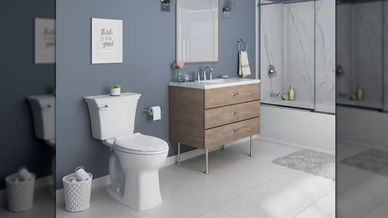 View of American Standard toilet in bathroom