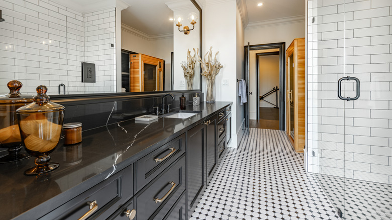 Large stylish bathroom with a tiled floor
