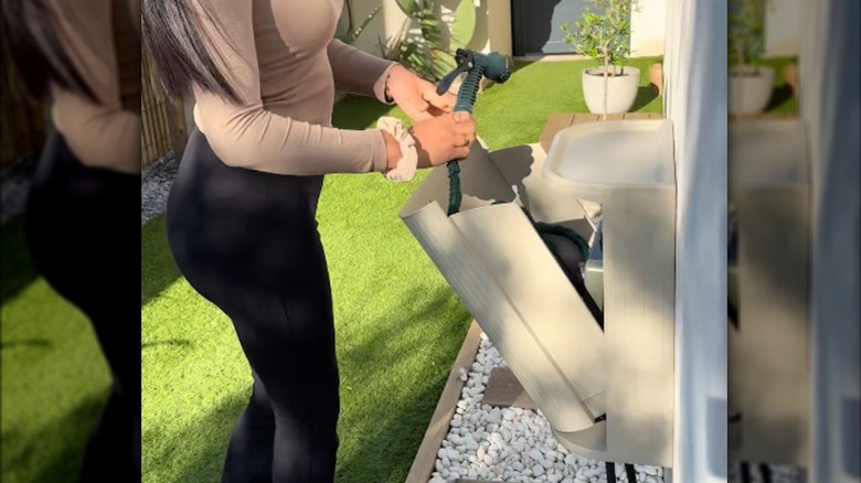 A handy hose storage box made with a GÅRDSBUTIK bin from IKEA
