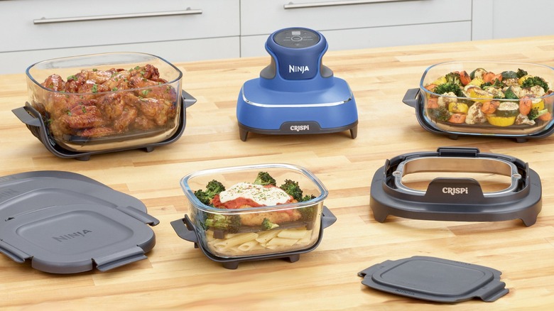 All the parts of Ninja Crispi 5-in-1 Air Fryer on kitchen island