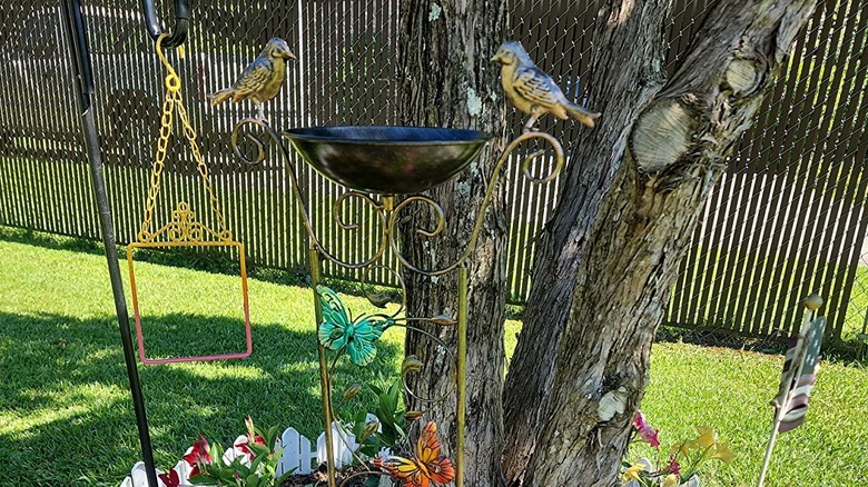 SUNNYPARK's Metal Birdbath Bowl with Garden Trellis in a garden by a tree