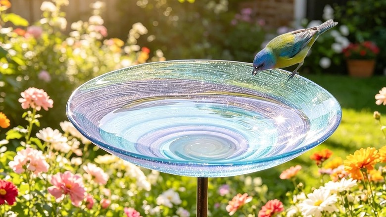 VCUTEKA's Stained Glass Birdbath with a bird perched on edge