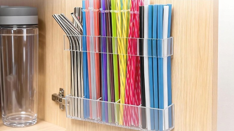 Rycid acrylic straw holder on a cabinet door