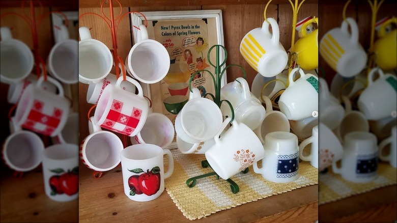 Colorful mug trees holding pyrex mugs