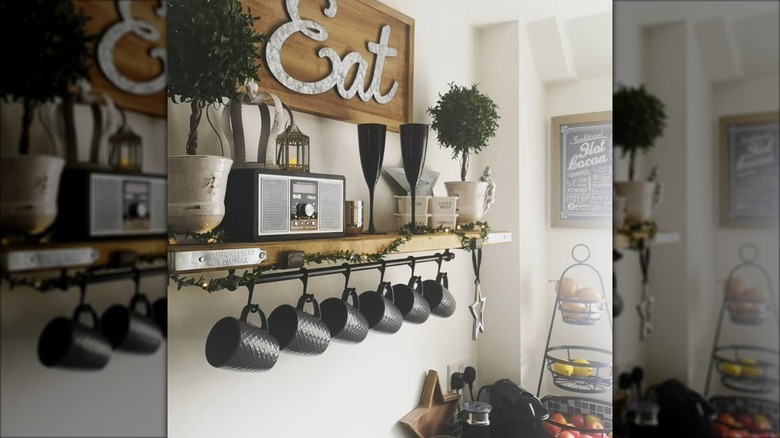 mugs hung on metal rod