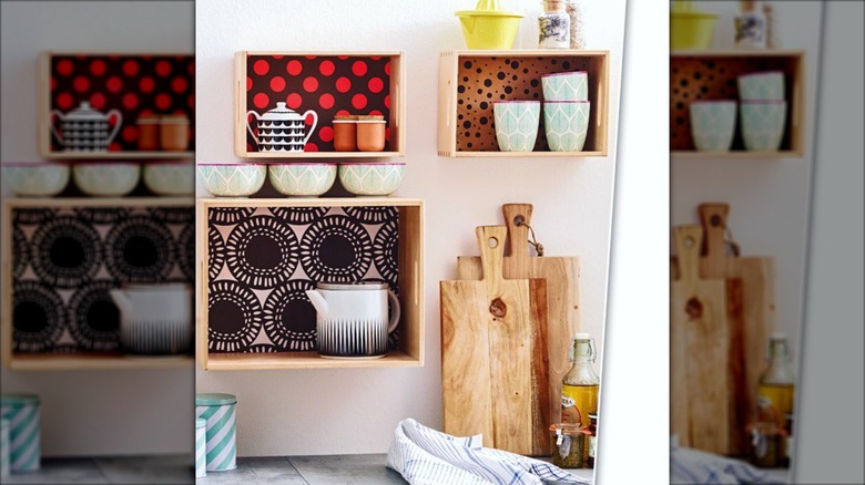 Mugs and dishware wooden crates on the wall
