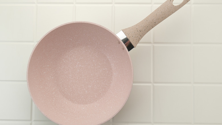 Closeup on pink ceramic frying pan