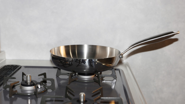 Stainless steel frying pan on stove