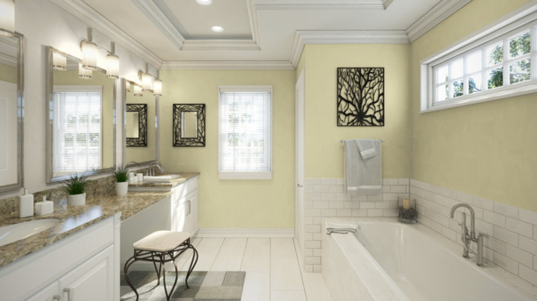 The walls of a spacious bathroom are painted with Sherwin-Williams Celery