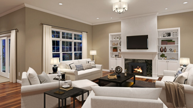 A spacious living room is painted with Sherwin-Williams Universal Khaki