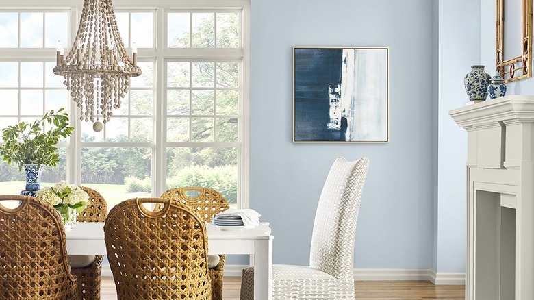 A light-filled dining room is painted Sherwin-Williams Upward