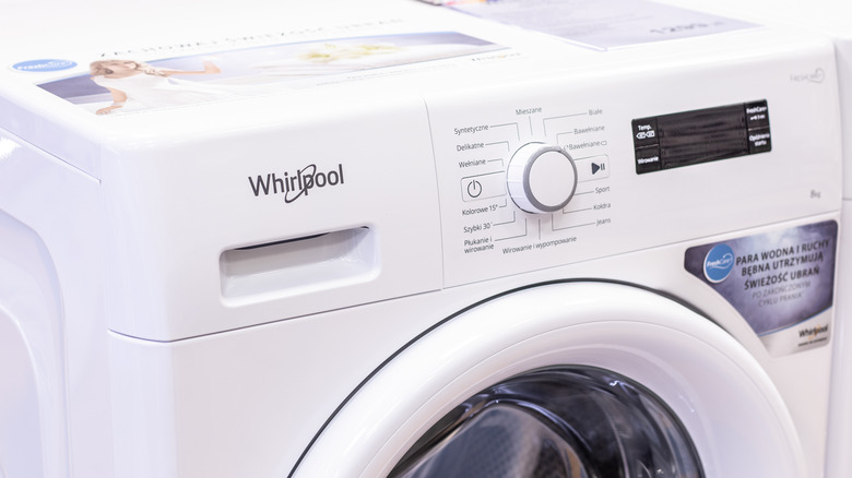 A white Whirlpool washer up close