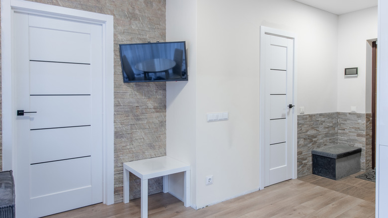 A damaged TV that was too close to a door.