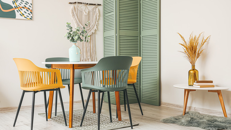 Dining table with colorful chairs