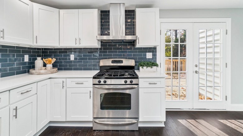 kitchen with blue backsplash
