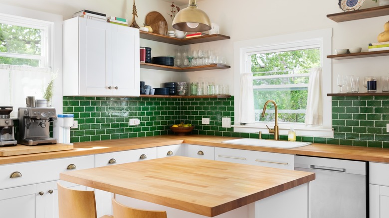 kitchen with green tile backsplash