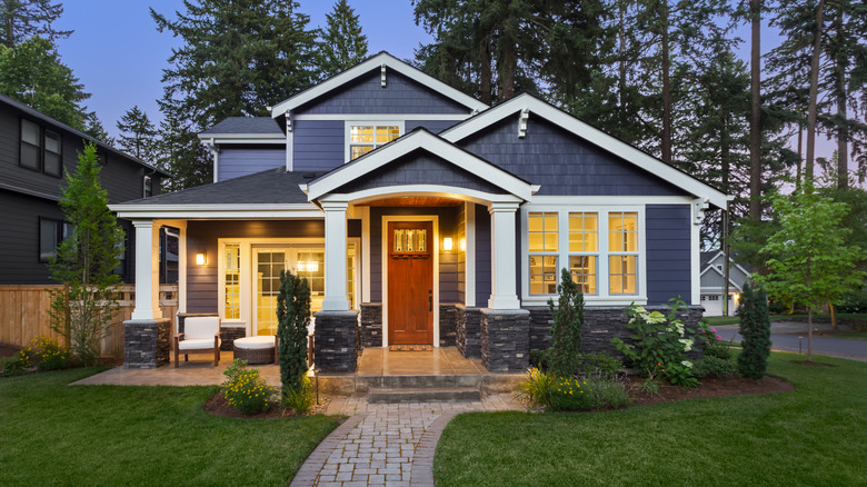 blue modern farmhouse in suburb