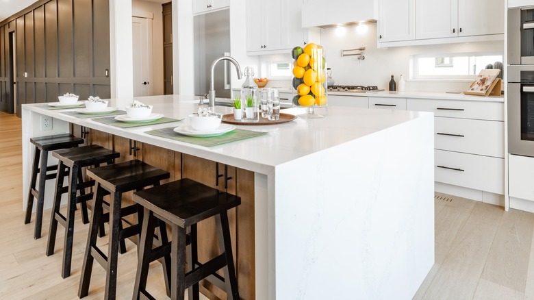 white kitchen with waterfall island
