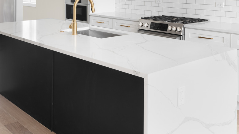 Waterfall countertop on white island