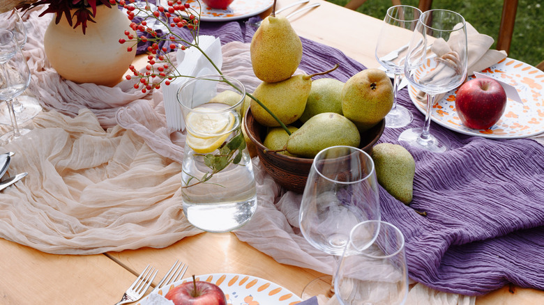 charcuterie boards on table with meats, cheese, bread, and fruit