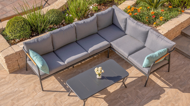 overhead shot of outdoor couch with gray cushions