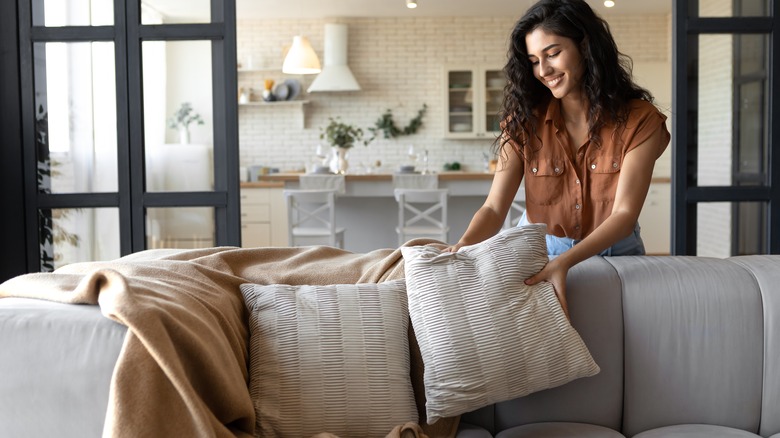 Woman decorating a living room