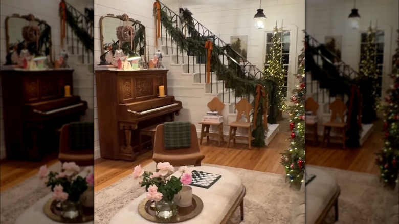 Joanna Gaines' farmhouse stairs adorned with garland and long ribbons.